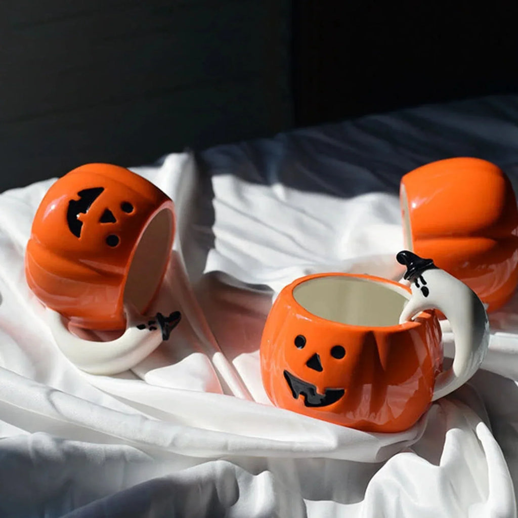 Ceramic Pumpkin Mug with Ghost Handle and Halloween Theme Design