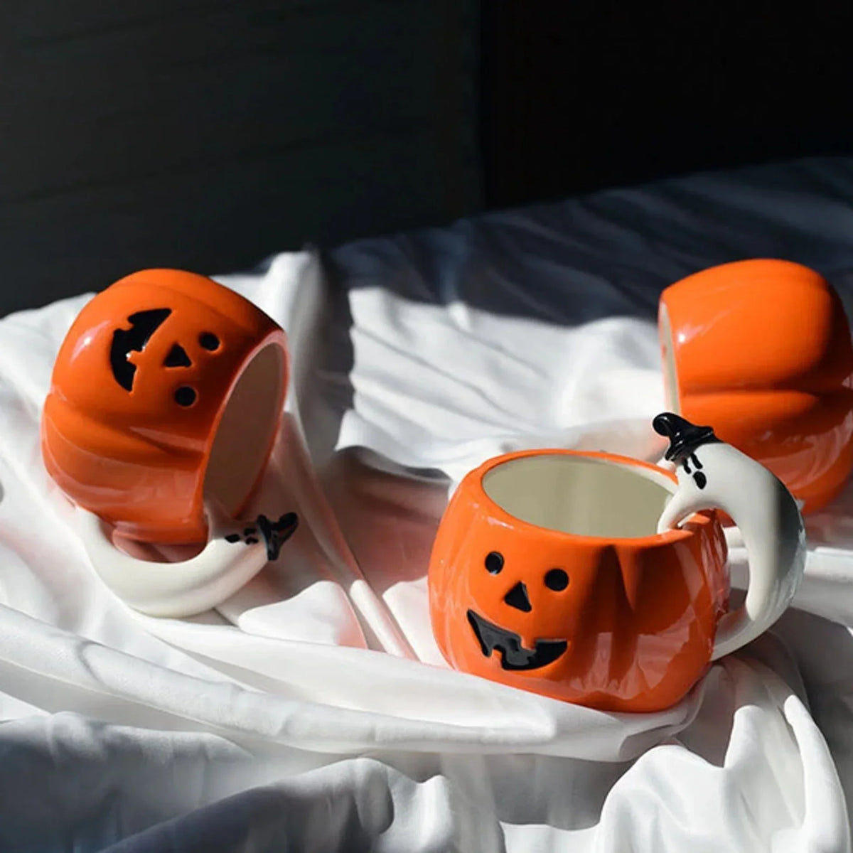 Ceramic Pumpkin Mug with Ghost Handle and Halloween Theme Design